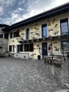 a building with balconies on the side of it at B&B FANCHETTI 1938 in San Sebastiano