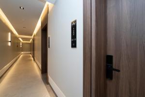 a door leading to a hallway with a hallway at Sunset Premium in Keramoti