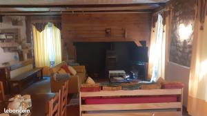 a living room filled with lots of boxes at Le Gite Des Peyreyres in Lespéron