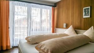 Säng eller sängar i ett rum på Apart-hotel Channa