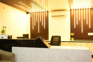 an office with a reception desk and a counter at Hotel O Westin Regency in Monber
