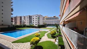 a balcony of a building with a swimming pool at Luisa in Malgrat de Mar