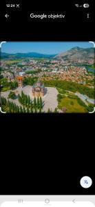 a view of a city with trees and buildings at Apartman Miljan in Trebinje