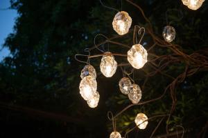 a bunch of lights hanging from a tree at Le Funi Hotel in Bergamo