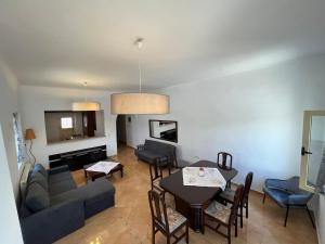 a living room with a couch and a table at Choios' House in Kondoliánika