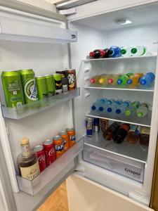 an open refrigerator filled with lots of food and drinks at Stan na dan Alex in Bijeljina