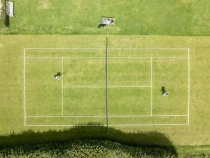 an overhead view of a tennis court in a field at Gins Barn in Southampton