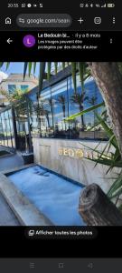a page of a website with a picture of a pool at Gharbi in Bizerte