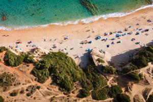 an overhead view of a beach with a group of people at Kampaoh Los Caños in Los Caños de Meca