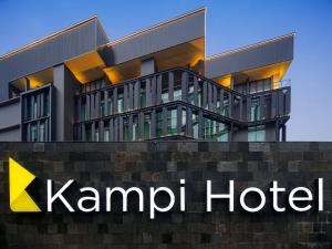 a building with a kpmid hotel sign in front of it at Kampi Hotel Sunter in Jakarta