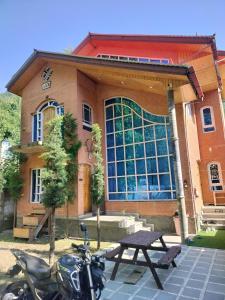 a motorcycle parked in front of a building at Urban Den Hostel in Srinagar