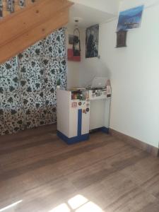 a room with a counter in the corner of a room at Urban Den Hostel in Srinagar +10 photos