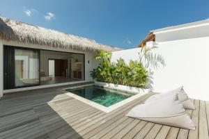 a villa with a swimming pool on a deck at Villa Papì Uluwatu 1 in Bingin Beach