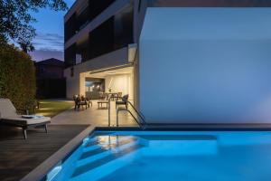 a swimming pool in the backyard of a house at Residence Maru' in Rovinj
