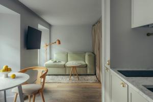 a living room with a couch and a table at Eden Locke in Edinburgh