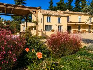 a house with a garden in front of it at Mon Chemin Privé in Mirabel-aux-Baronnies
