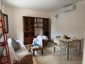 a living room with a couch and a table at Casa Giulia in Palau