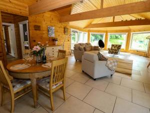 a kitchen and living room with a table and chairs at Bulrush Cabin in Carlisle