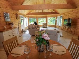 a dining room with a table in a cabin at Bulrush Cabin in Carlisle