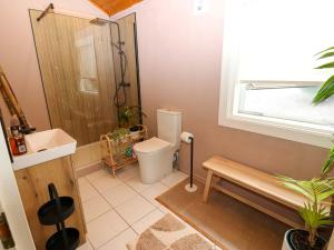 a bathroom with a shower and a toilet and a sink at Bulrush Cabin in Carlisle +40 photos