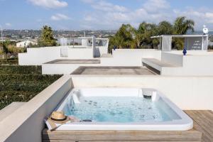 a hot tub on the roof of a house at Villa Argentea in Ragusa