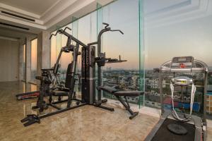 a gym with a view of a city at Marquis Hotel in Ban Bang Toei (1)