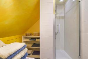 a shower with a glass door in a bathroom at Le Lys De Mer - Chambre in Dragey +14 photos