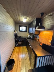 a kitchen with a counter top in a room at Hyggeli in Vadsø