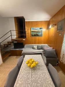 a room with a table with fruit on it at Green Quiet Apartments in Vodice