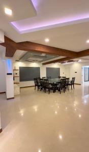 a conference room with a table and chairs at Luxe Kochi Flat Backwater Views in Cochin