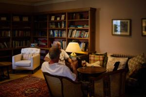 a couple of people sitting in a living room at The Arundell in Lifton