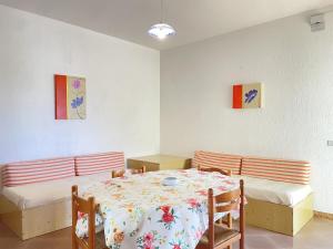 a dining room with a table and two chairs at CASA CALIPSO - Casa a pochi passi dal mare delle Maldive del Salento in Salve