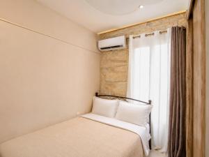 a bedroom with two beds and a window at Cretan Nature Villa Alexandra in Zaros +36 photos