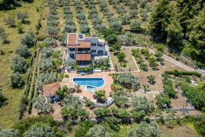 an aerial view of a house with a swimming pool at Nature Grand Estate - Spacious Villa with Pool in Skopelos Town