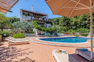 a villa with a swimming pool and a house at Nature Grand Estate - Spacious Villa with Pool in Skopelos Town +50 photos