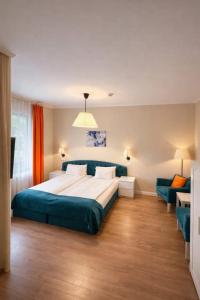 a bedroom with a large bed and a couch at Transylvania Villa & Spa in Muntele Băişorii +43 photos