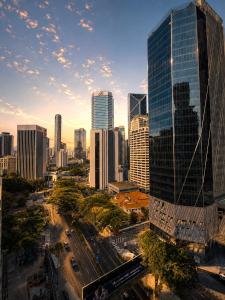 a city skyline with skyscrapers in a city at deKing Hotel Twin Towers by DK Hospitality in Kuala Lumpur
