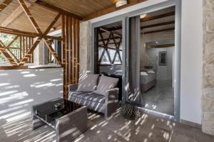 a living room with a couch and a table at Agorastos Luxury Living in Platamonas +140 photos