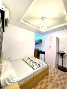 a room with a bed and a desk in it at The Hideout in Lagos