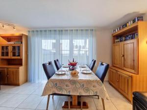 a dining room with a table and some chairs at Apartment Luchre by Interhome in Zermatt