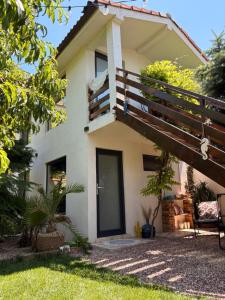 a house with a balcony on the side of it at Casa Saga proprietate administrata de o gazda particulara in Mangalia