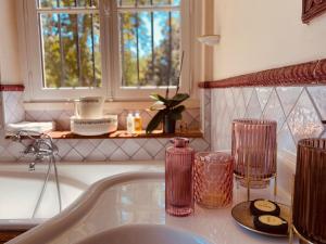 a kitchen counter with a sink and a window at Château Bois-Martin in Léognan +30 photos