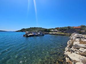 a group of boats docked at a dock in the water at Holiday Home Marica by Interhome in Tkon