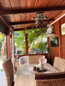 a table with a plate of fruit on it on a patio at Casa Saga proprietate administrata de o gazda particulara in Mangalia