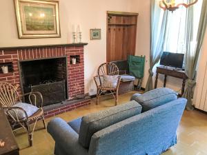 a living room with a couch and a fireplace at Holiday Home Nicol by Interhome in Trarego