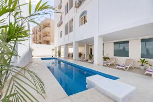an image of a swimming pool in a house at Seven Stays Centric West Zayed in Sheikh Zayed