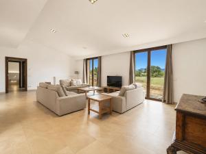 a living room with two couches and a tv at Holiday Home Can Toni by Interhome in Inca