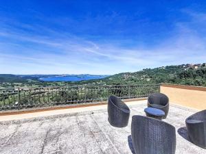 a balcony with chairs and a view of the water at Holiday Home Casa Martina by Interhome in Montefiascone