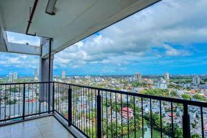 a balcony with a view of a city at Skyline Views Pool access Central Location in Yakbedda