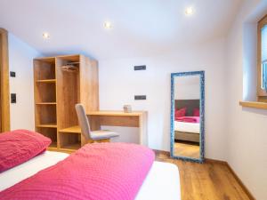 a bedroom with a bed and a mirror at Apartment Miramonte-6 by Interhome in Kappl +22 photos
